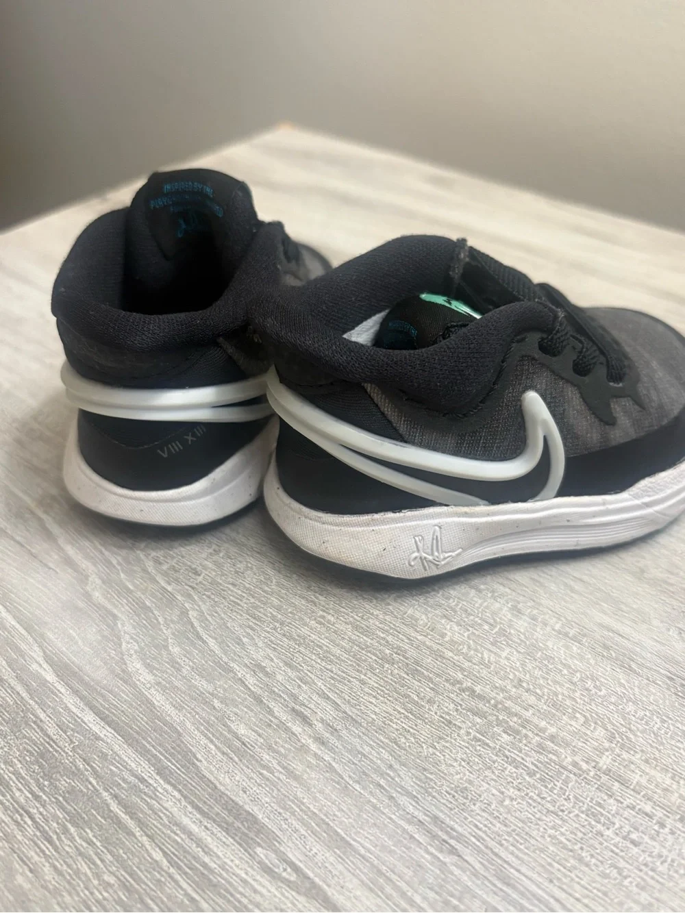 Nike Kids Black Sneakers with Teal Accents
